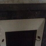 White veined black marble fireplace