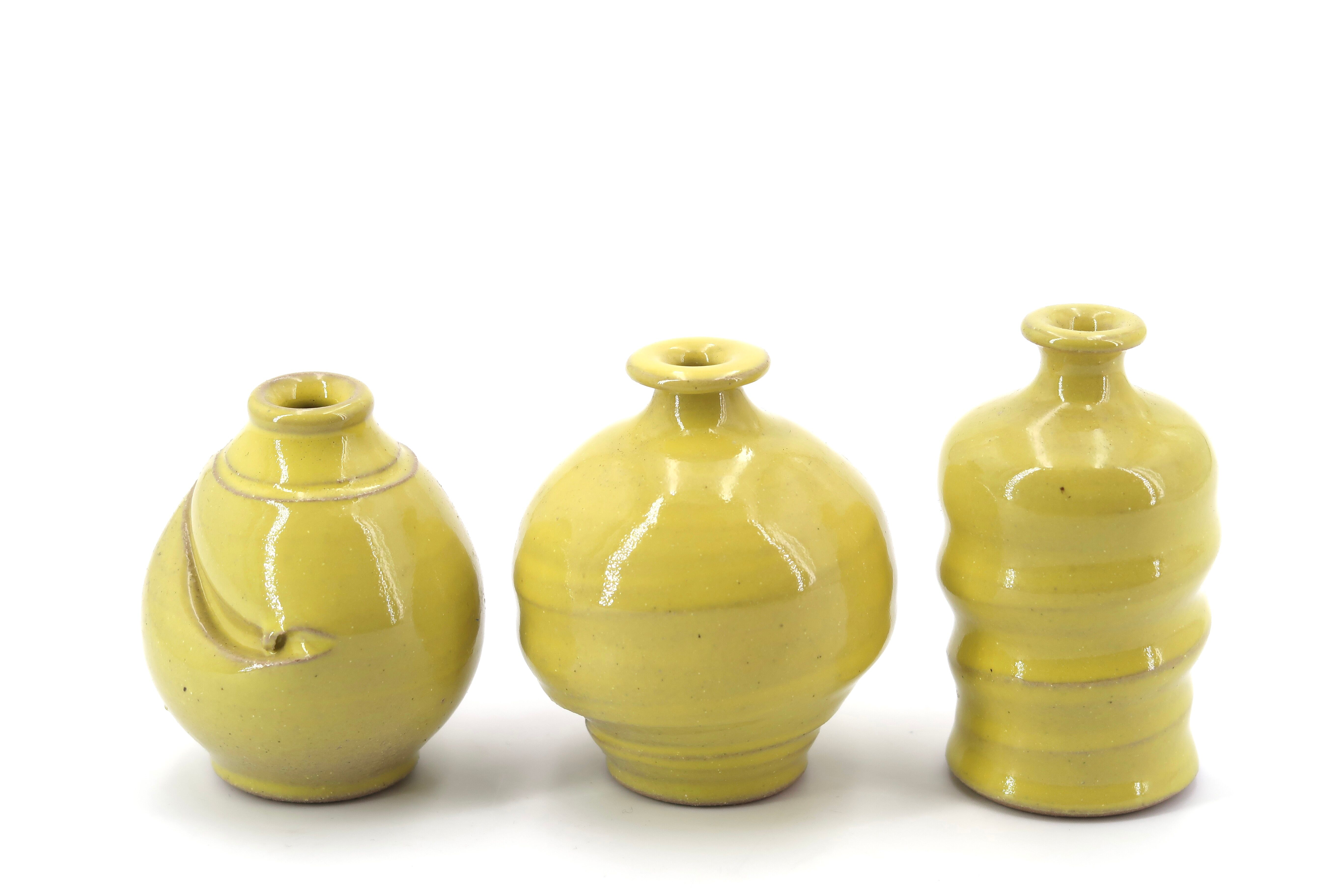 Trio of yellow ceramic vases, 70s