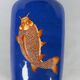 China, 19th century porcelain vase with a carp design on a blue background