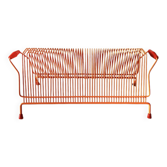 Vintage orange metal record rack for 50 vinyl records