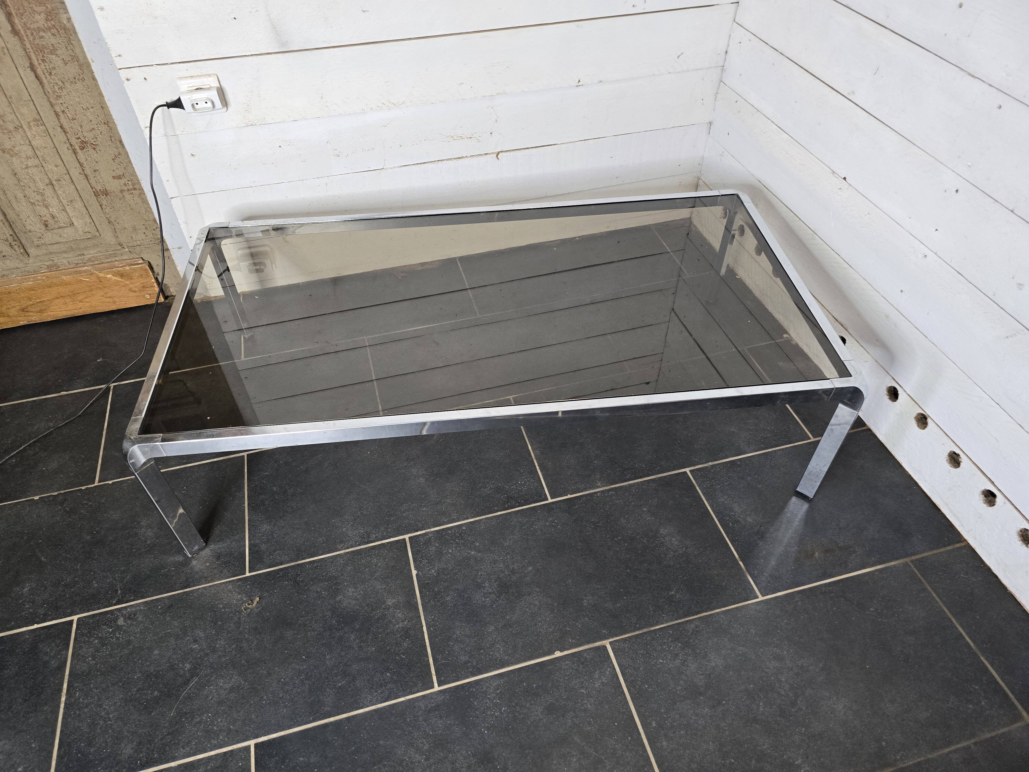 Chromed metal coffee table with smoked glass top from the 70s