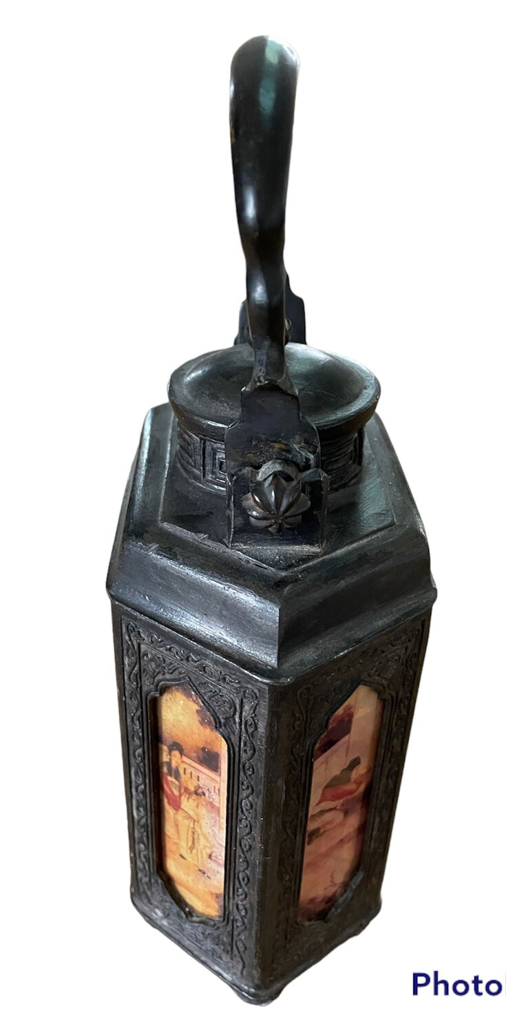 Ancient Asian teapot made of pewter and glass