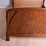 Wooden bed, early 20th century.