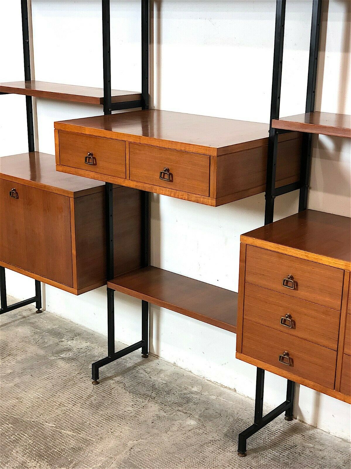 Modular storage unit and teak bookcase. Italy, 60s