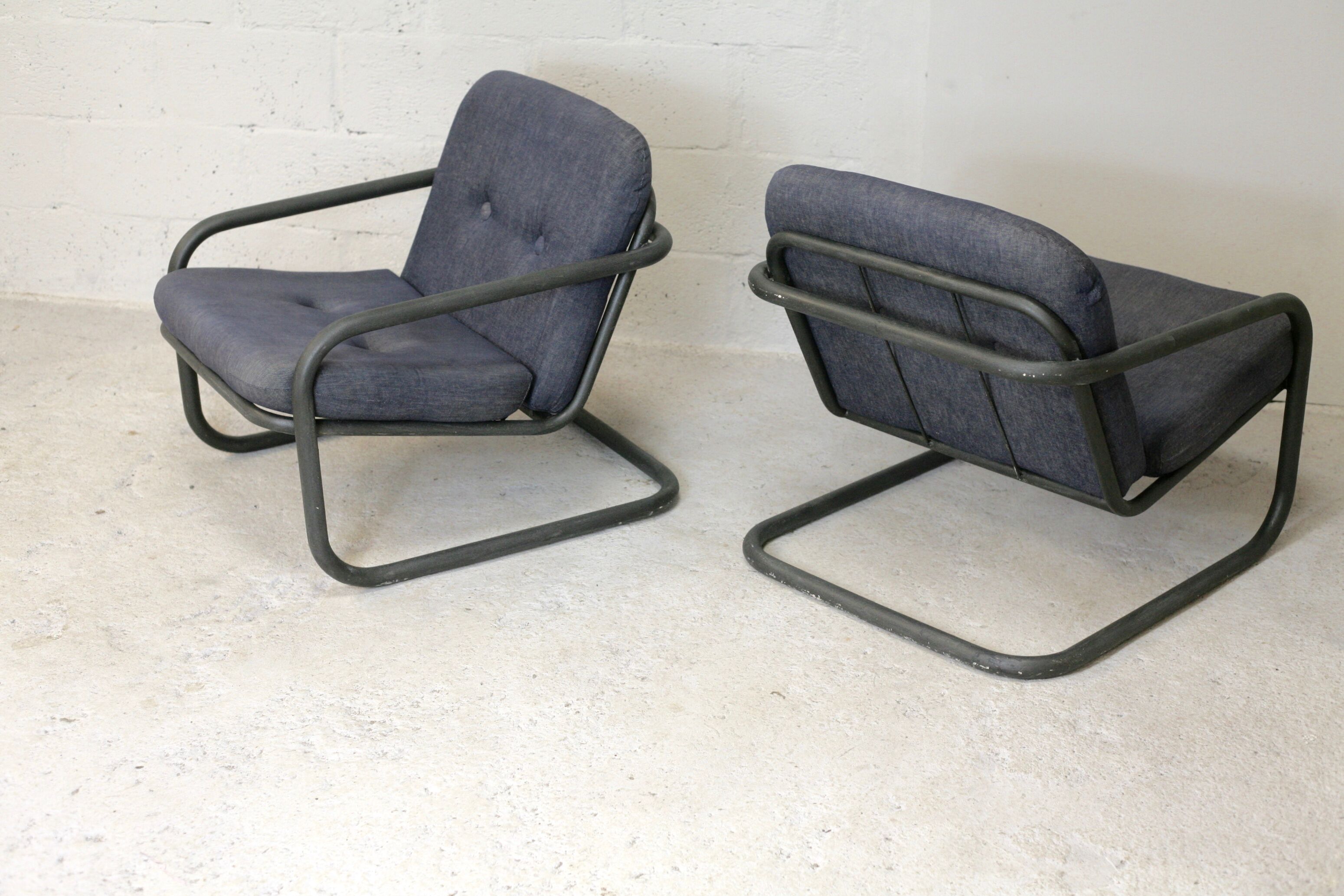 Pair of Prisunic edition armchairs, tubular steel and foam cushions, France, 1973