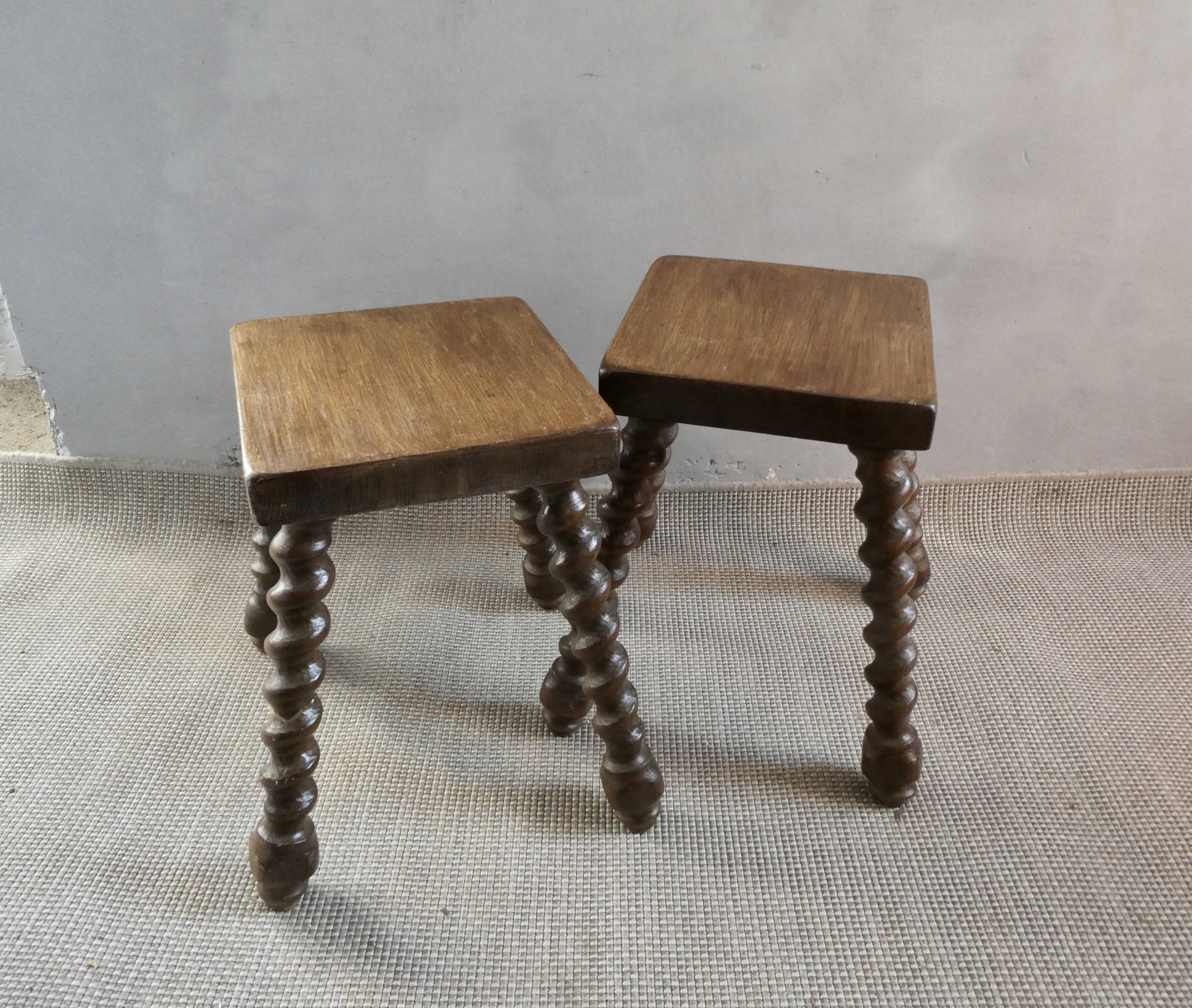 Pair of solid wood stools, carved legs