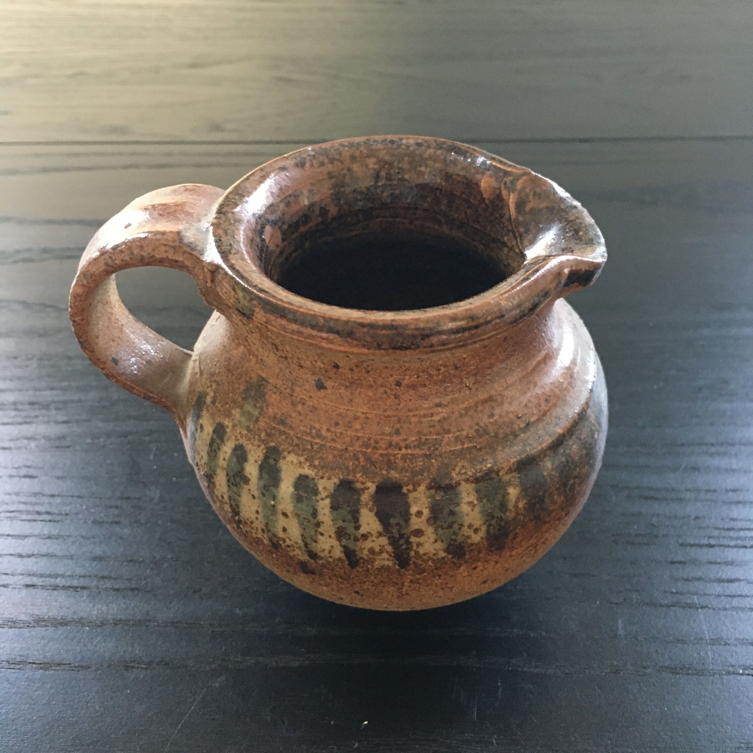 Stoneware pitcher with striped decoration