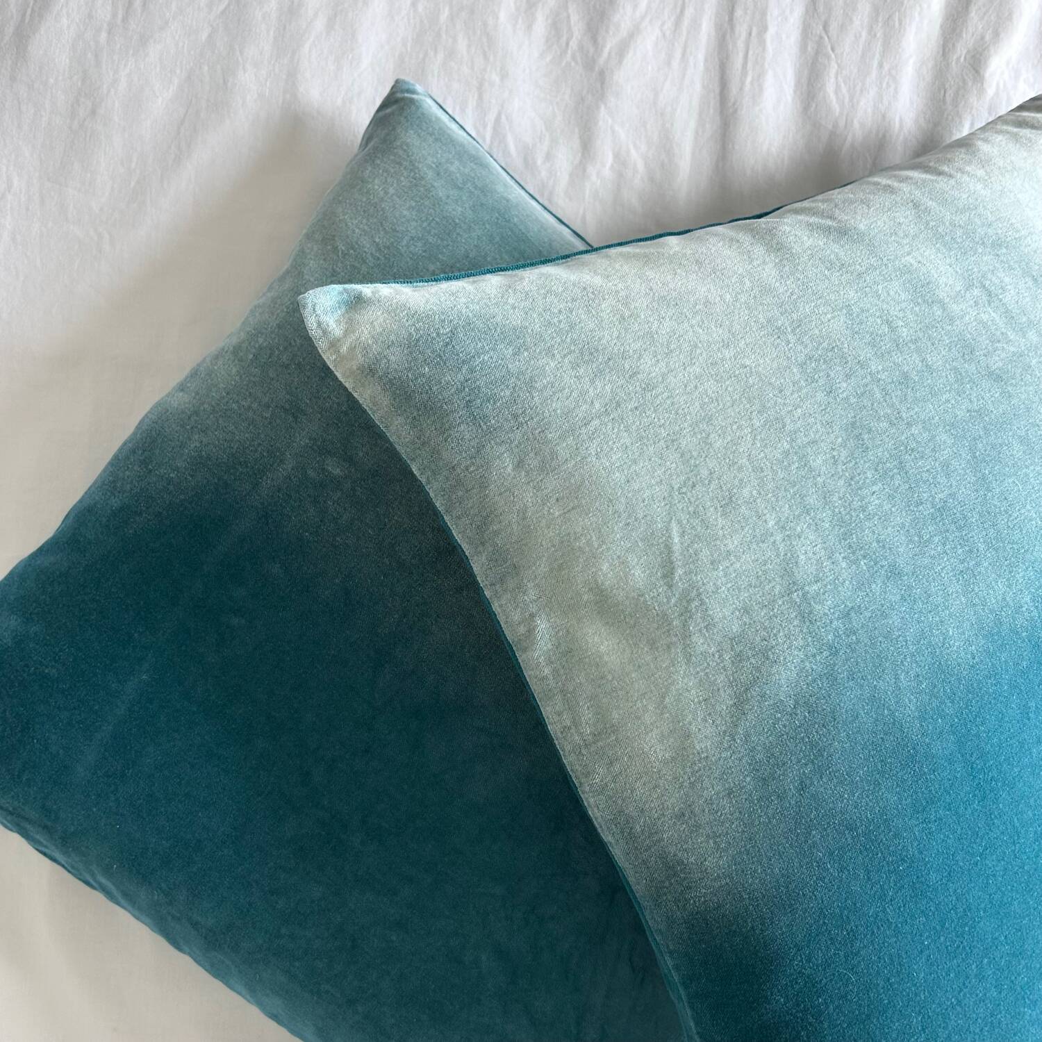 Pair of turquoise velvet cushions