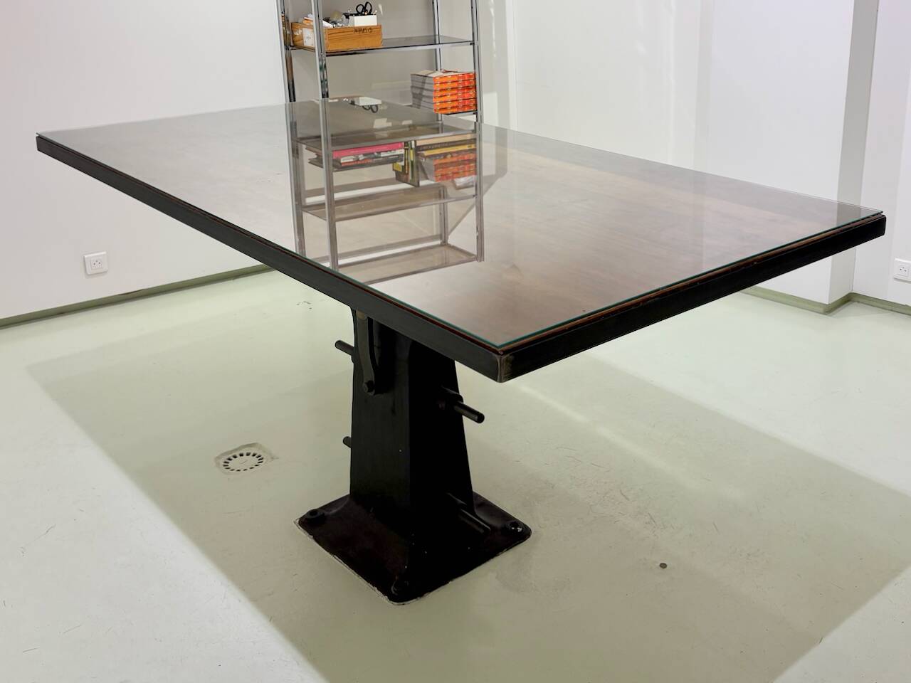 Industrial table with cast iron legs.