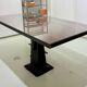 Industrial table with cast iron legs.