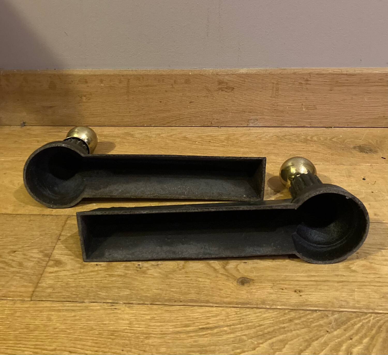 Pair of Napoleon III andirons from the 19th century in cast iron and brass