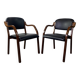 Paire de fauteuils en cuir et bois
