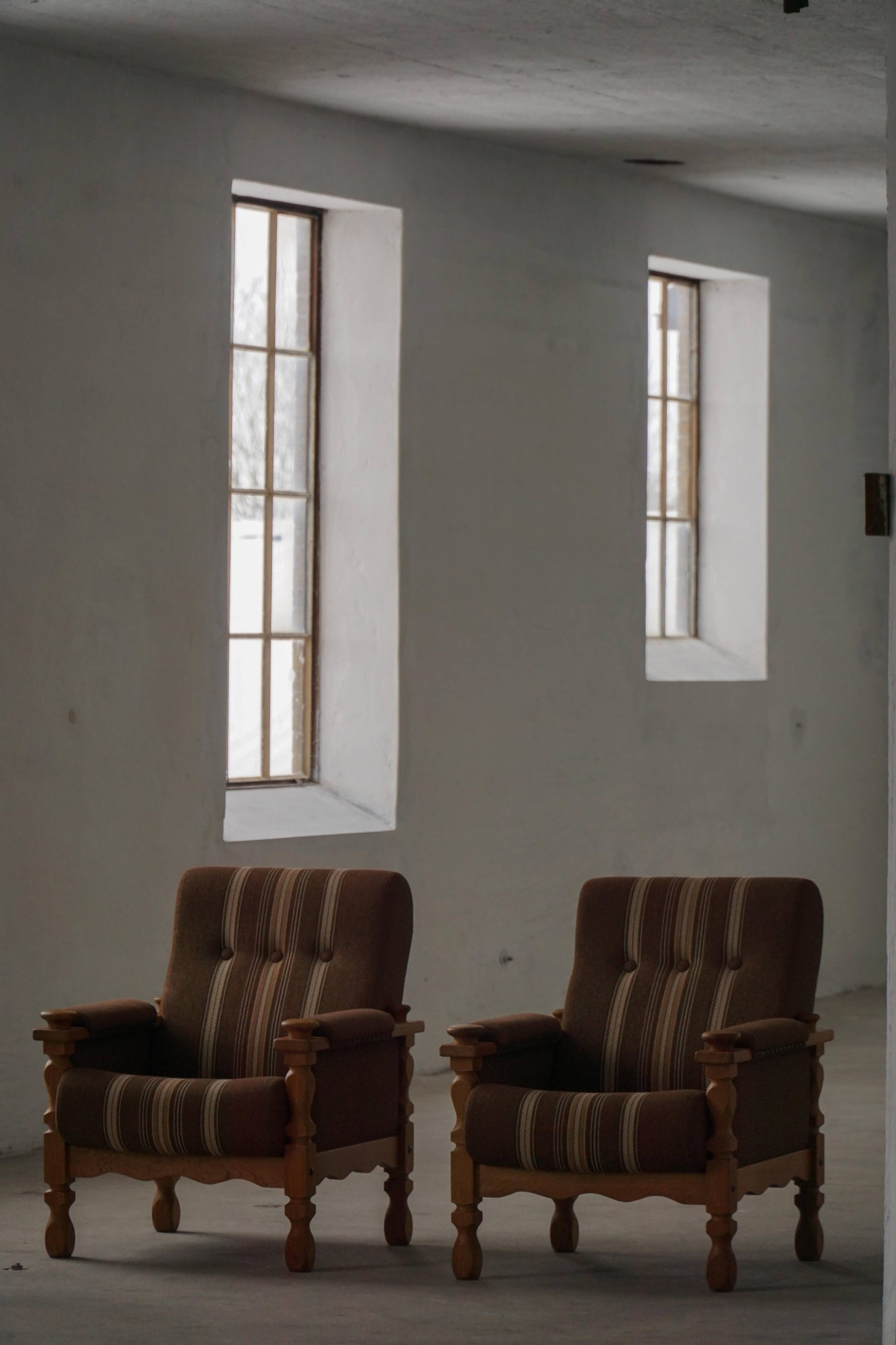 Modern Danish, a pair of lounge chairs in oak and wool, Henning Kjærnulf, 1960s.