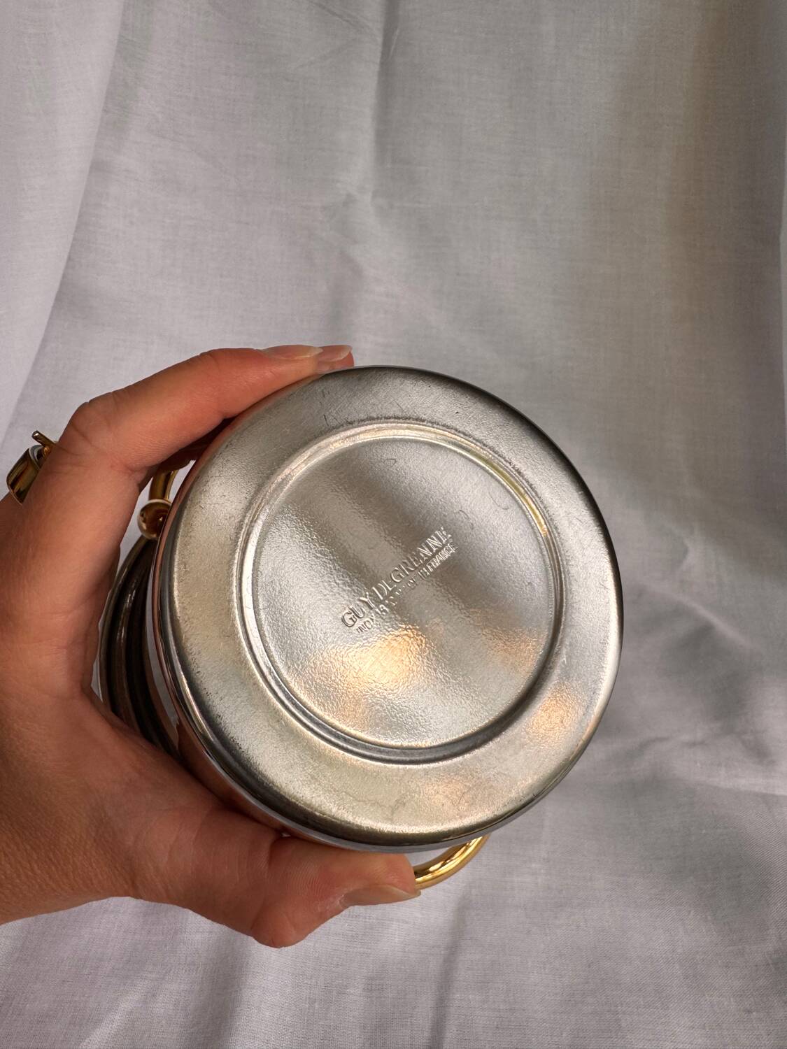 Guy Degrenne stainless steel ice bucket with golden handles