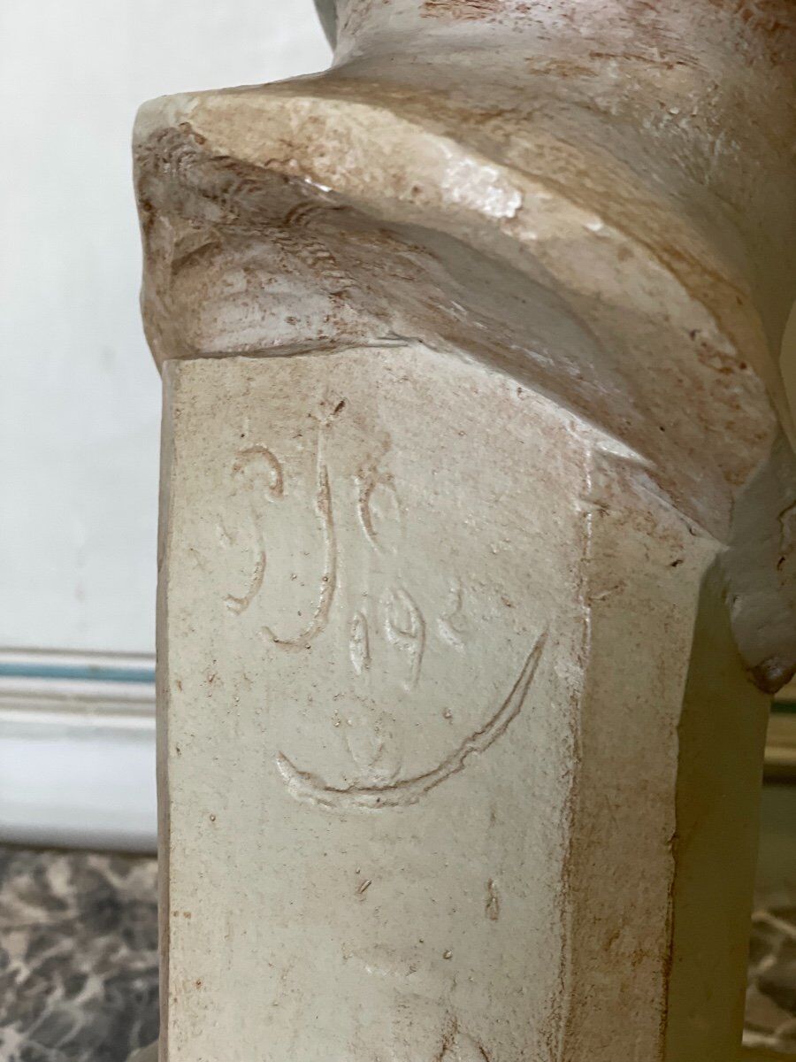 Plaster bust, young girl, monogram and date.