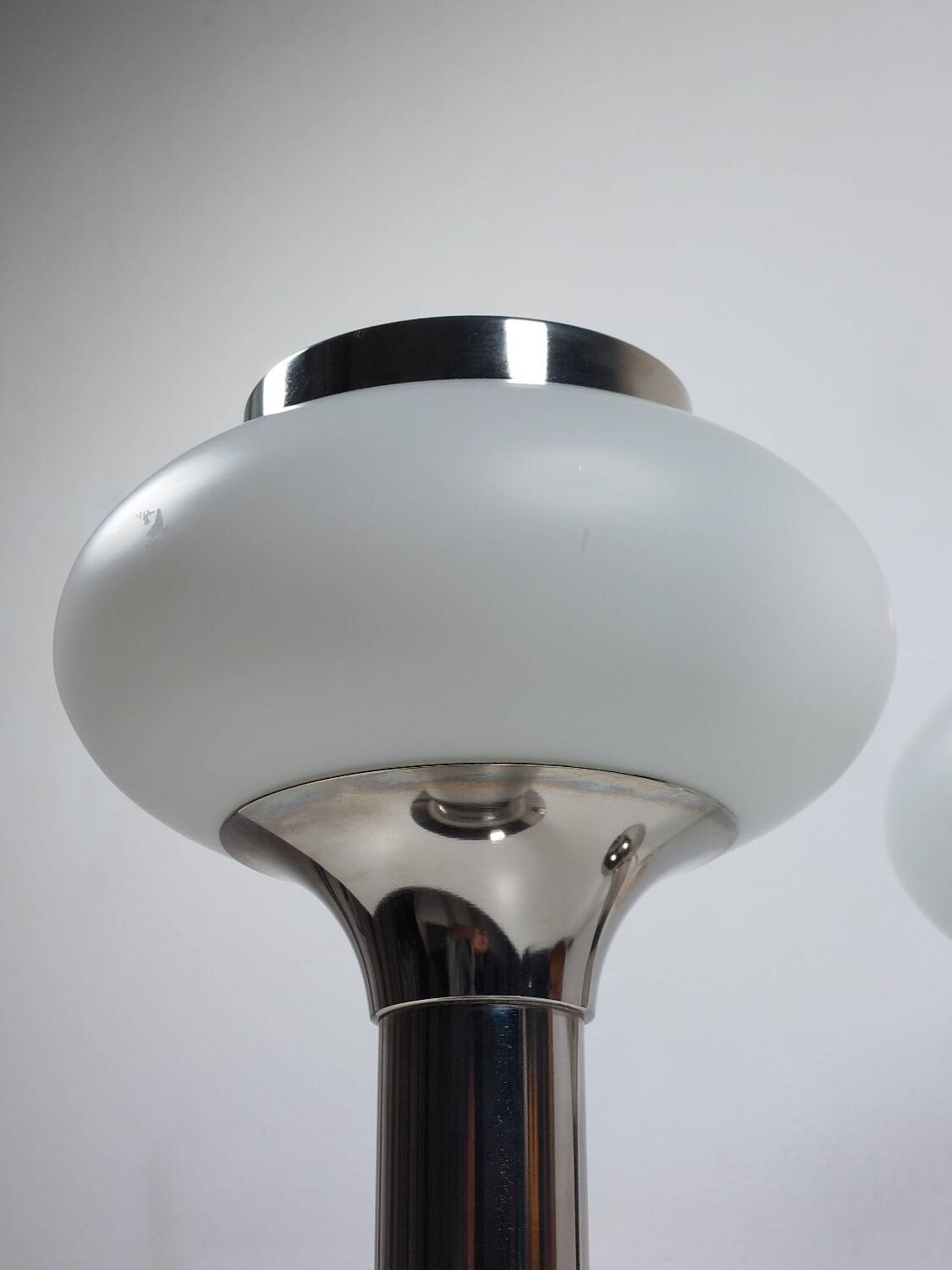 Pair of vintage futuristic style table lamps in chrome and opal glass.