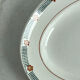 Oval presentation plate Saint Amand with bicolour floral decoration.