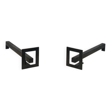 Pair of modernist andirons in steel and wrought iron