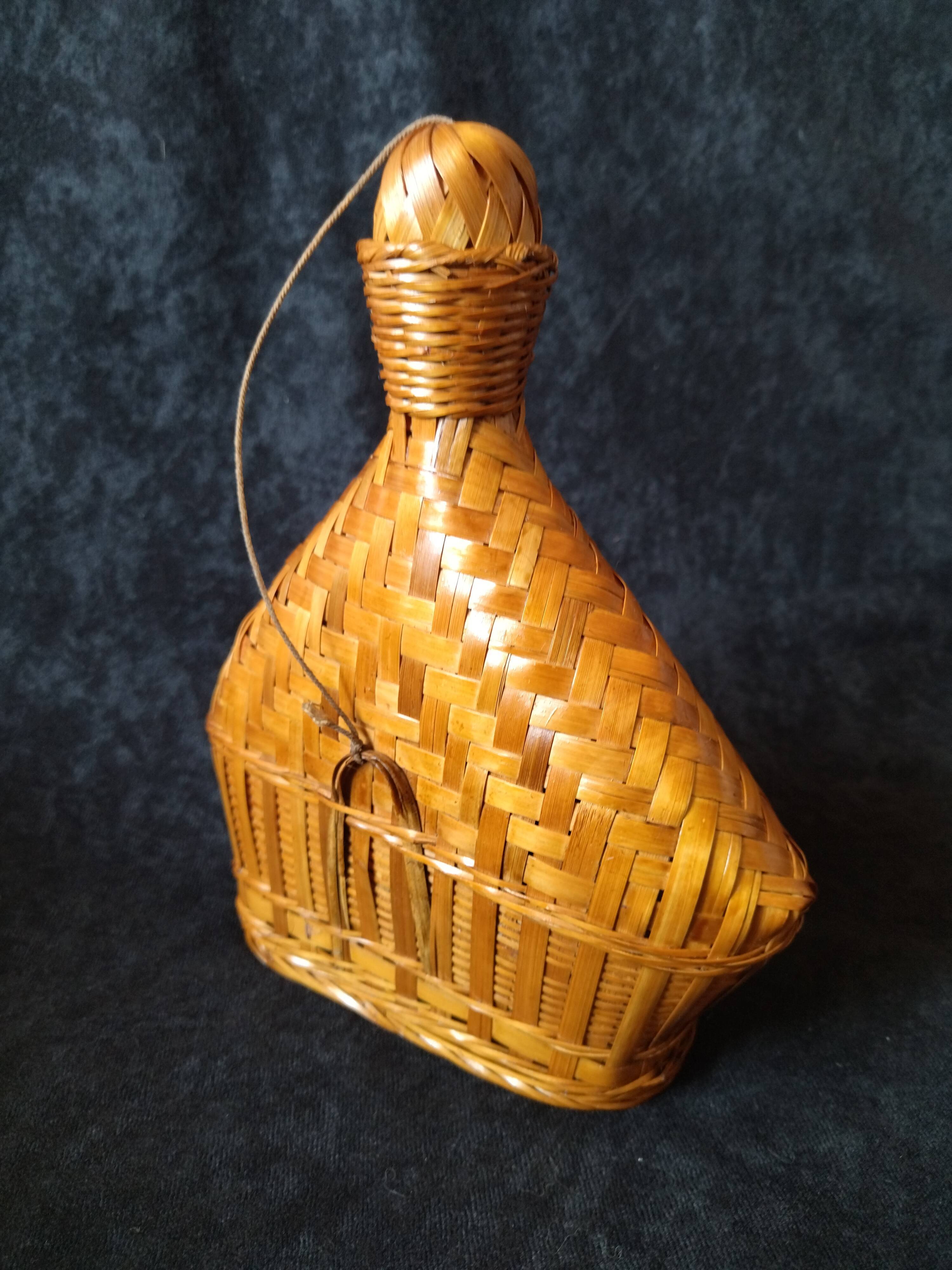 Vintage wicker and braided bamboo bottle