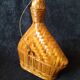 Vintage wicker and braided bamboo bottle
