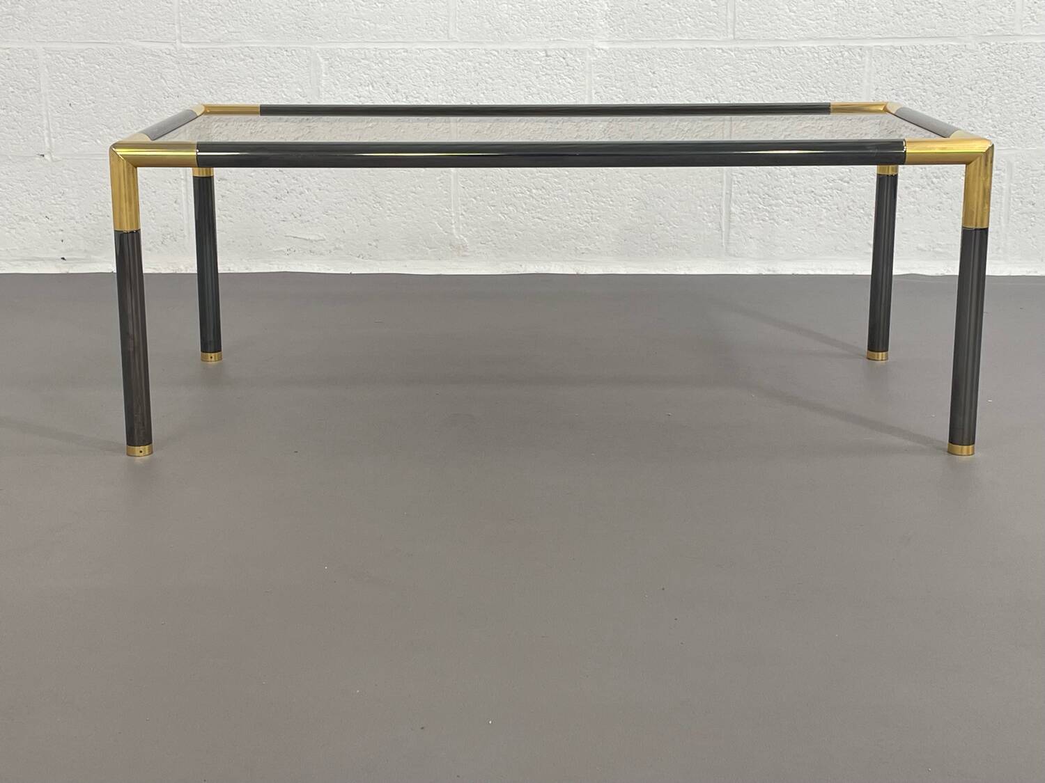 Gunmetal gold metal and smoked glass coffee table from the 70s