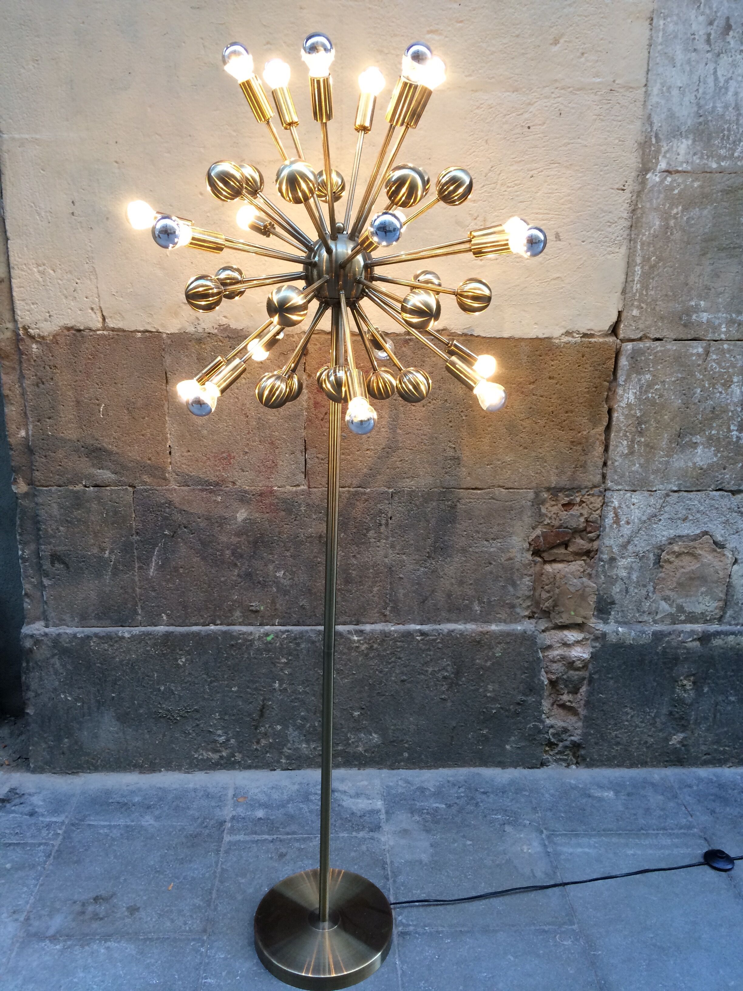 Floor lamp in gold metal of the 1960s