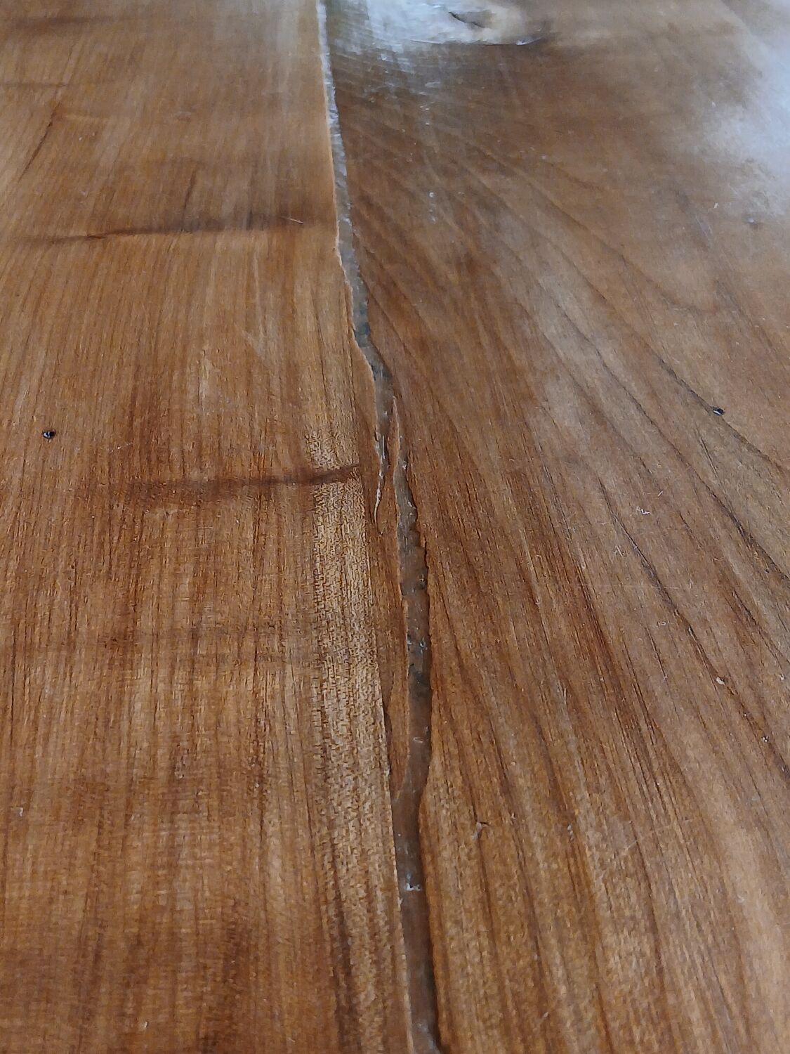 Elm farmhouse table with extensions for 6 to 10 people.