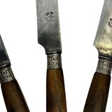 12 couteaux As de trèfle manche en corne, virole métal argenté, fin XIXème