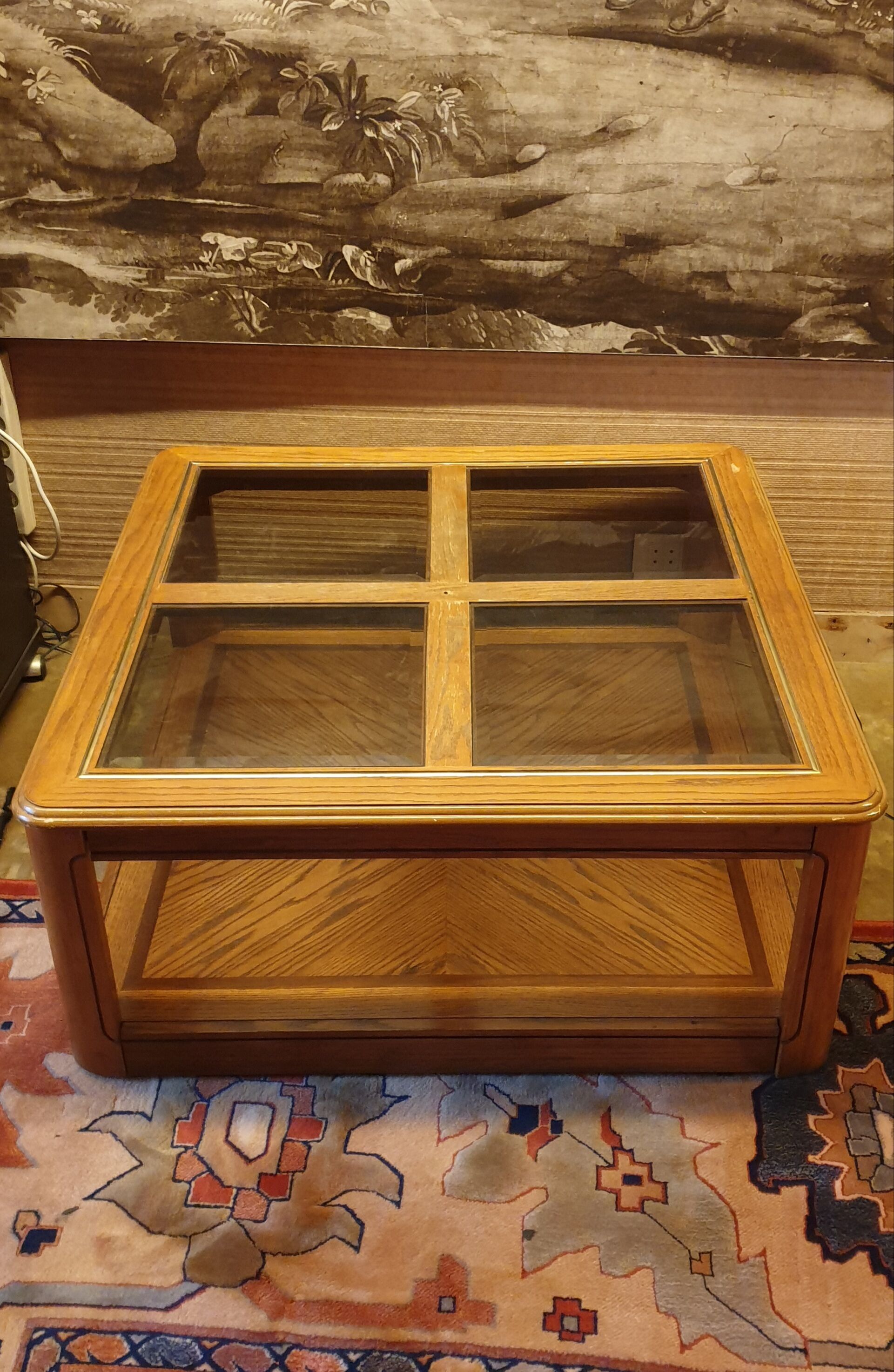 Wood and glass coffee table on wheels
