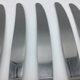12 silver metal knives.