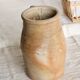 Old rustic stoneware jar with handle