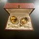 2 Snail-shaped salt pots in gold-colored porcelain