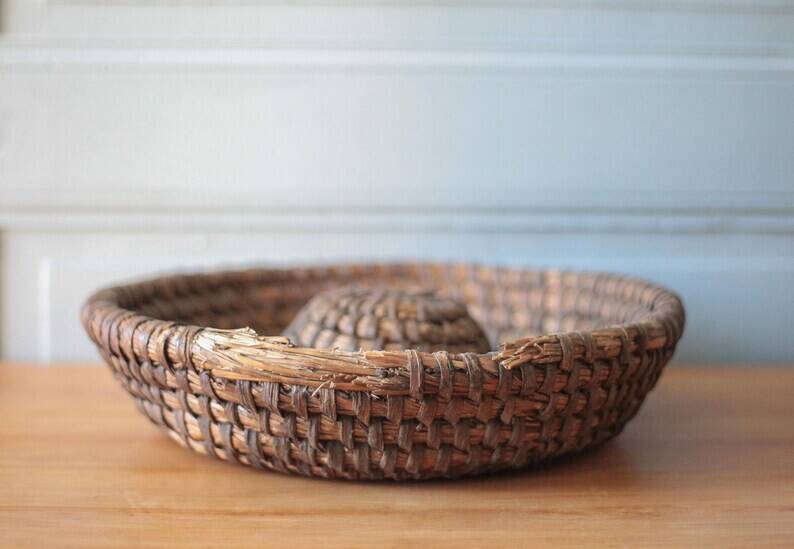Old wicker basket, straw and bramble, woven basket, countryside, chalet, kitchen, interior decoration.