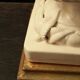Vintage white ceramic table lamp from Manises with a raised leaf design.