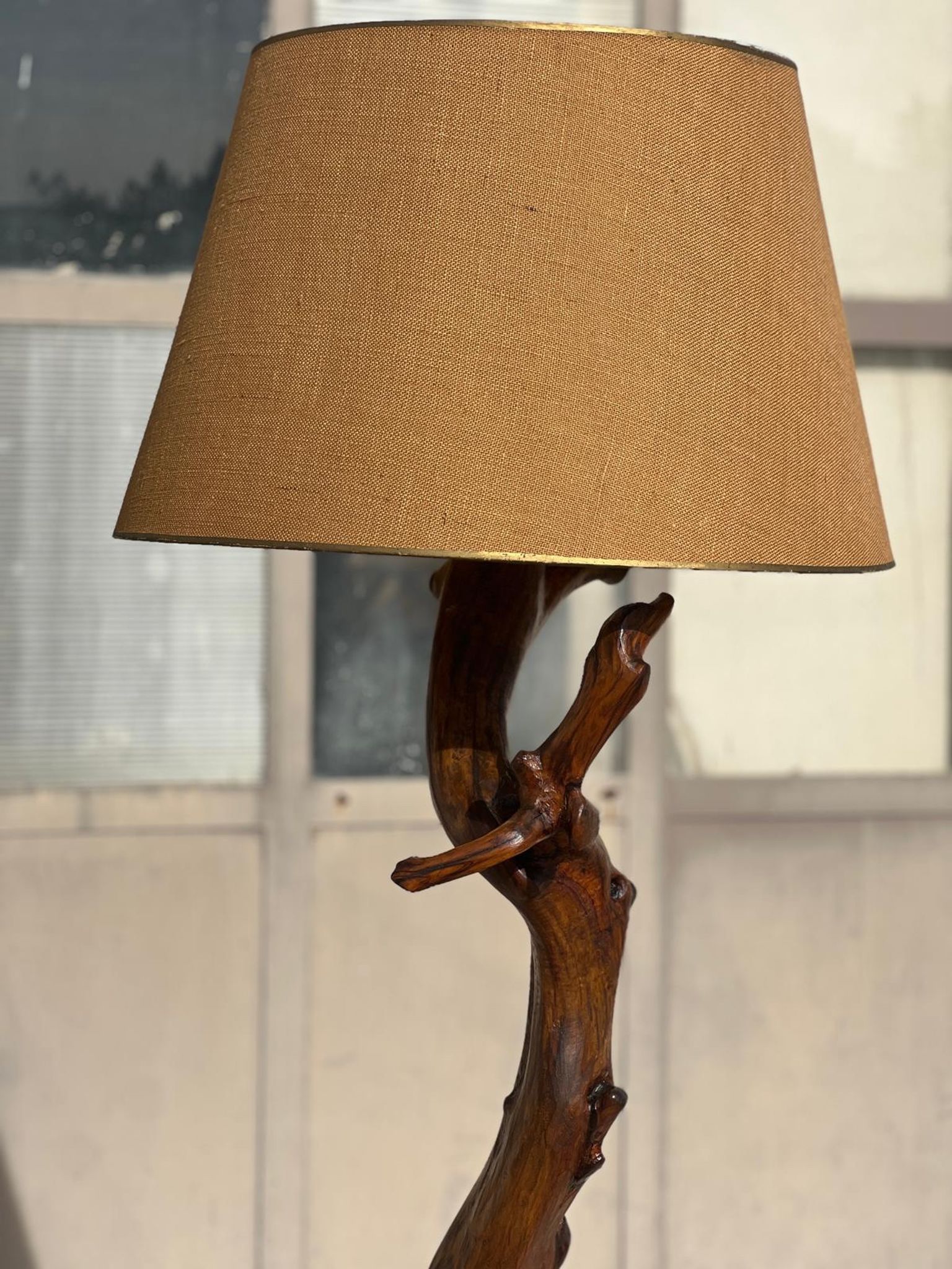 Floor lamp in solid olive wood, Brutalist style, French work from the 1970s.
