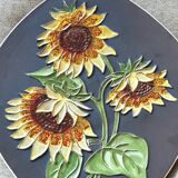 Decorative wall plate with sunflowers.