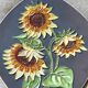 Decorative wall plate with sunflowers.