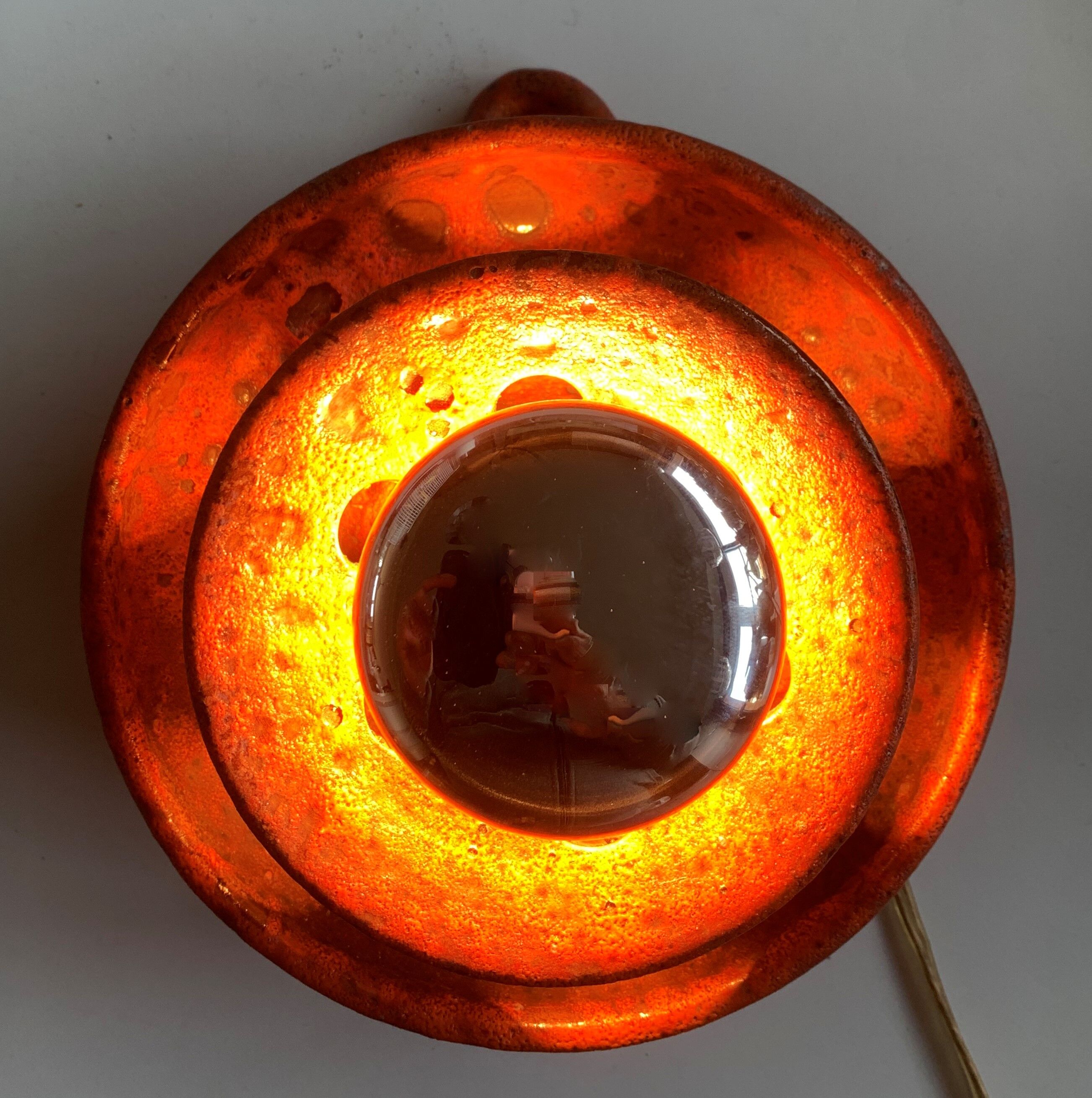 Ambient spot in orange glazed terracotta from the 1960s