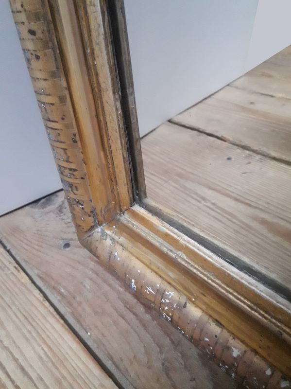 Golden Louis Philippe mirror H122xW84cm with gilded motifs.