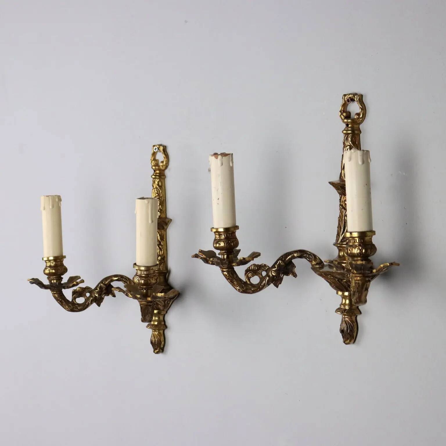 Pair of antique wall sconces in bronze, Italy, 20th century.