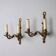 Pair of antique wall sconces in bronze, Italy, 20th century.