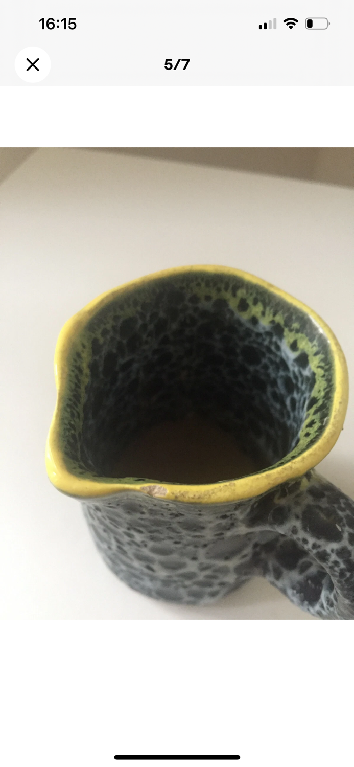 Set of two small Vallauris yellow and black milk jugs