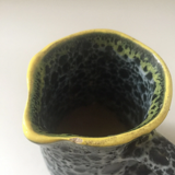 Set of two small Vallauris yellow and black milk jugs