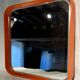 Square thermoformed mirror in orange plastic from SALC