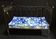 Wrought iron bed and bluish wool mattress