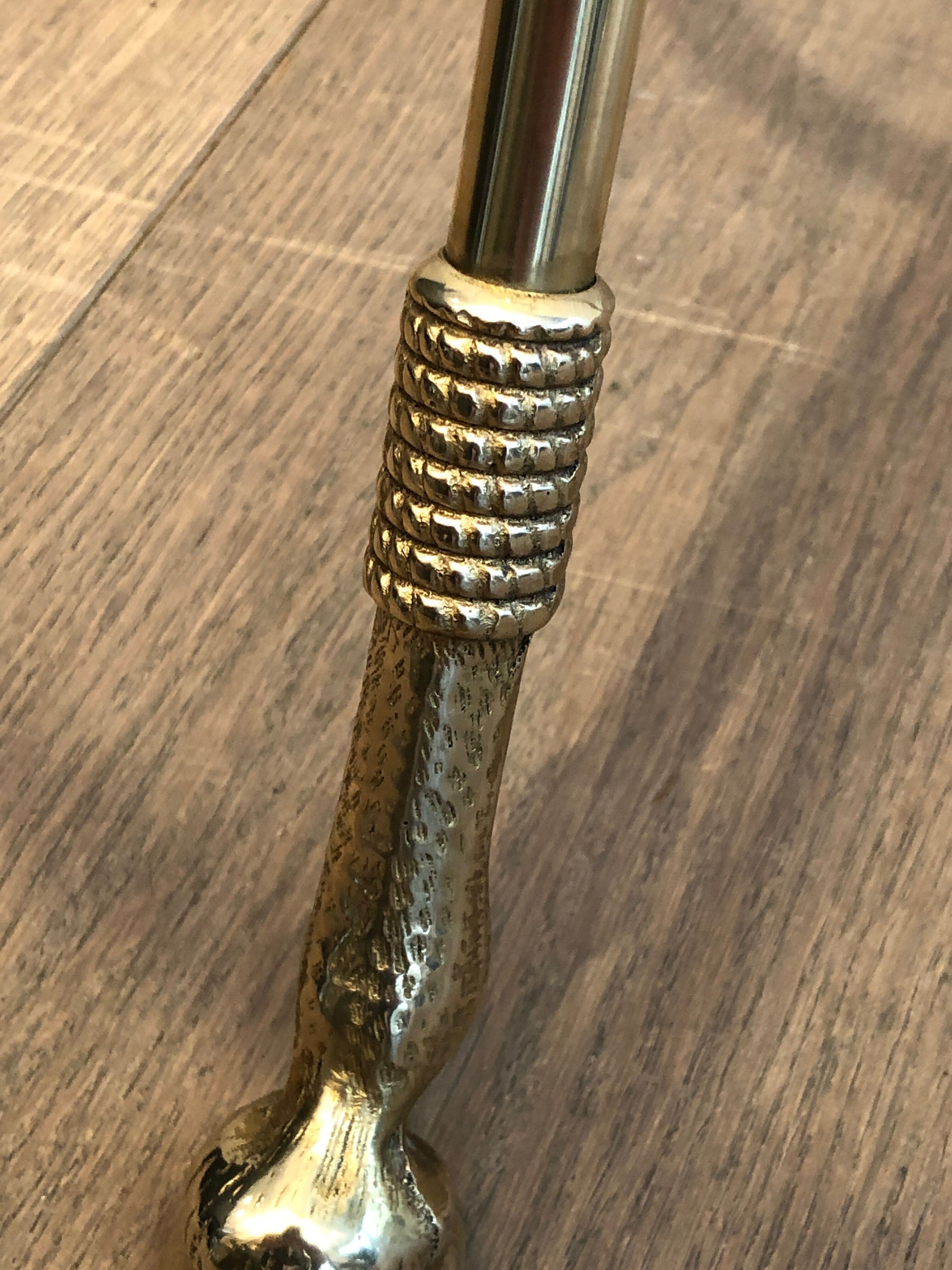 Neoclassical style tripod pedestal table in brass and round glass top in the taste of the House