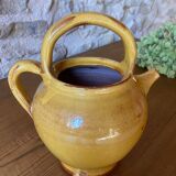 Jug or chevrette in yellow glazed stoneware