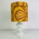 Temde lamp with turned wood and a seventies lampshade.