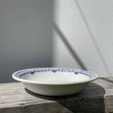 Round, shallow ceramic salad bowl from Saint Amand