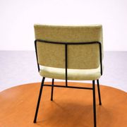 Vintage 1950s chair in black metal and almond green fabric.
